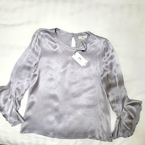 H Halston silver ruffled cuff blouse. M.